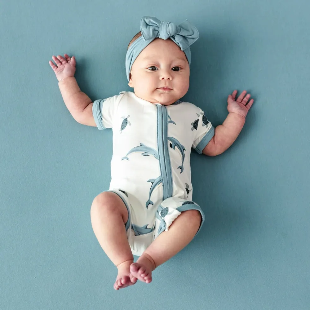 Kyte Baby Zipper Shortall Romper in Dolphin