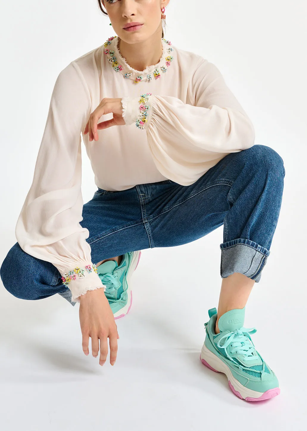 Off-white high neck top with bead embellishments