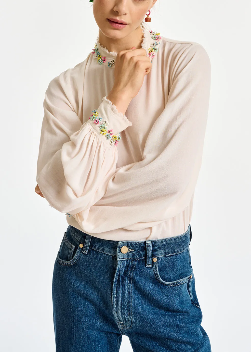 Off-white high neck top with bead embellishments