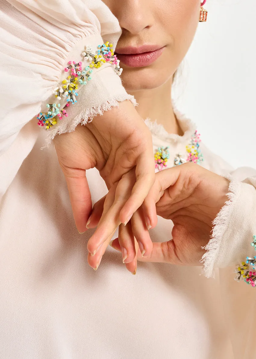Off-white high neck top with bead embellishments