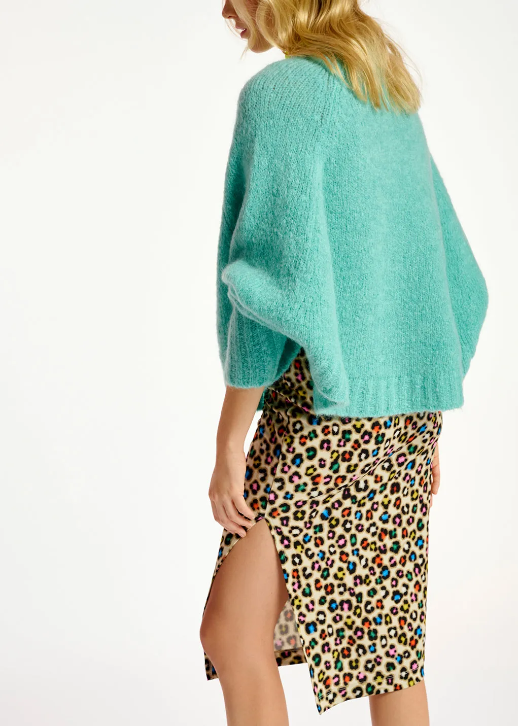 Turquoise knit sweater with cape effect
