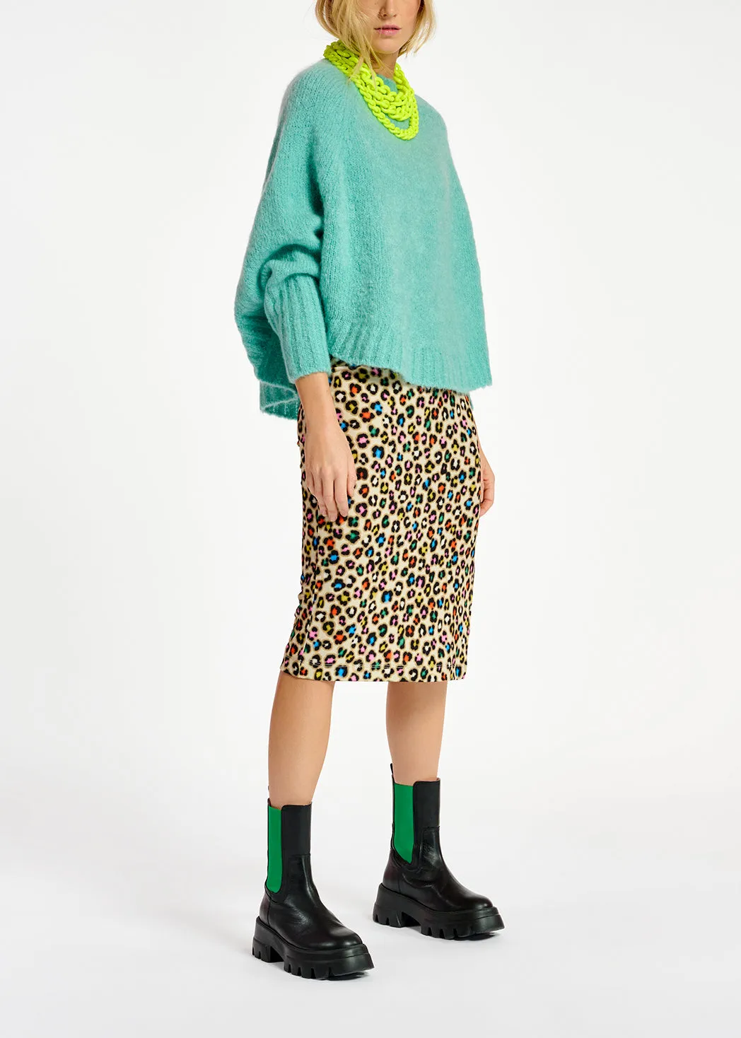 Turquoise knit sweater with cape effect