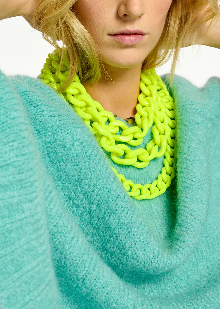 Turquoise knit sweater with cape effect