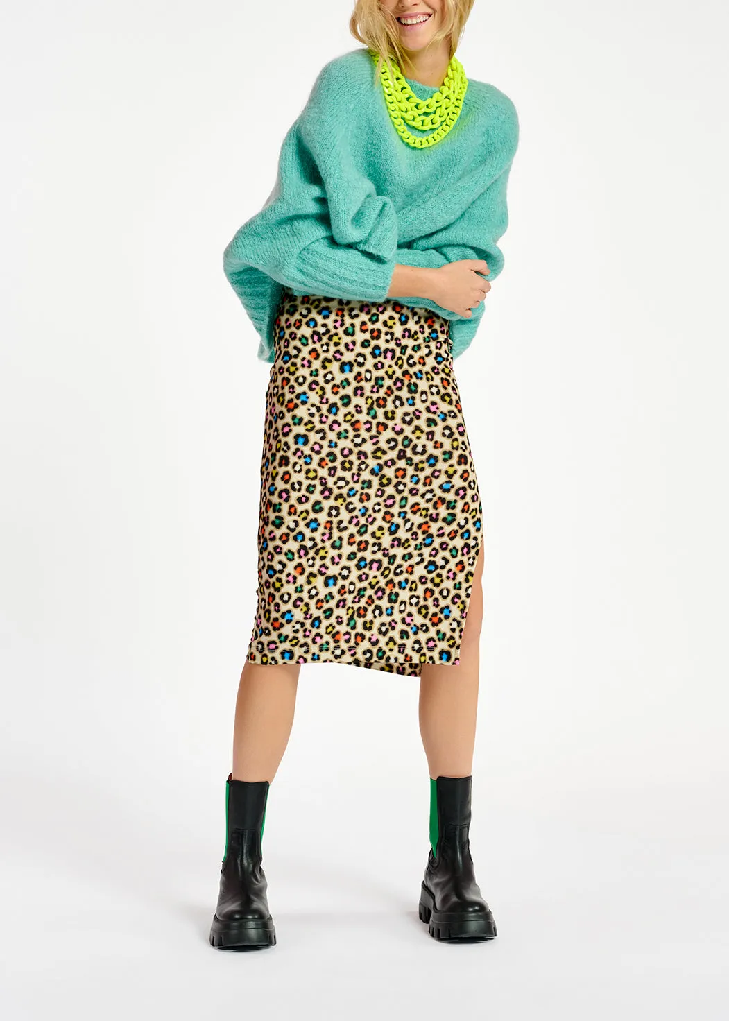 Turquoise knit sweater with cape effect