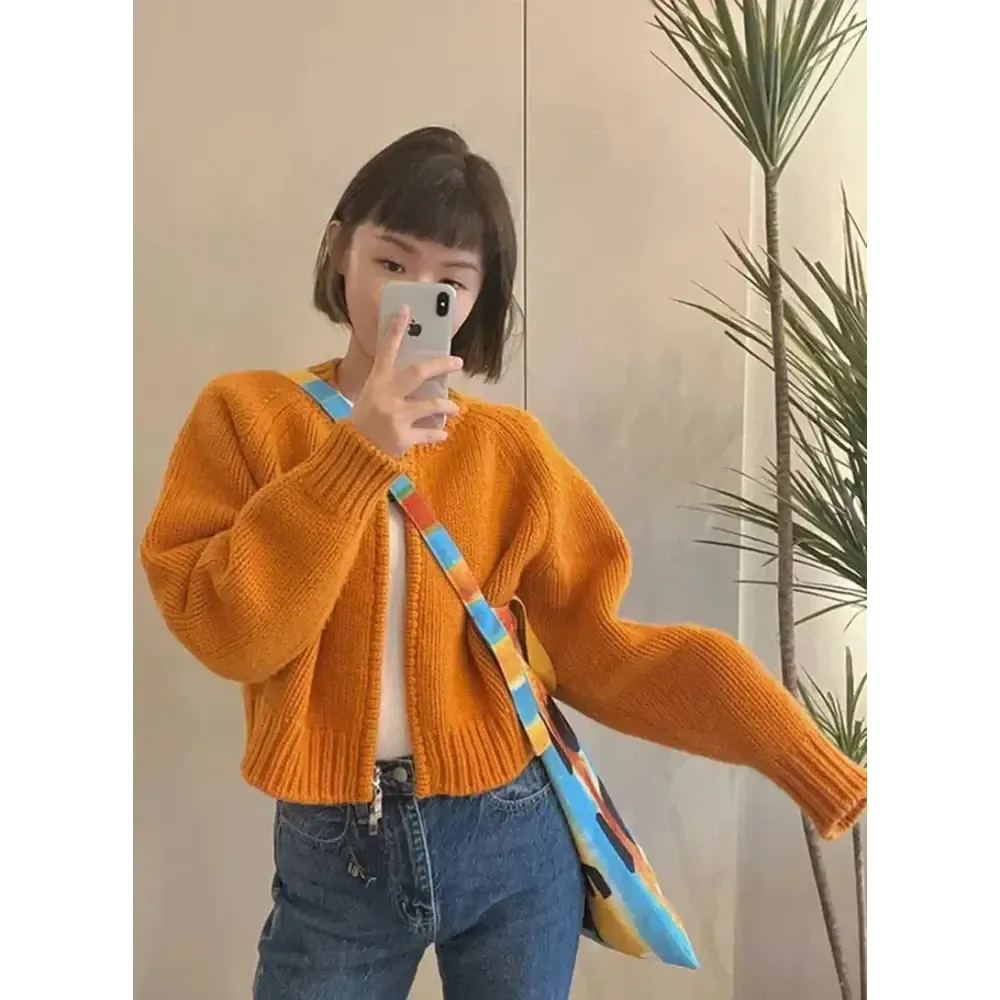 Vibrant Solid Orange Knitted Cardigan with Crew Neck Design