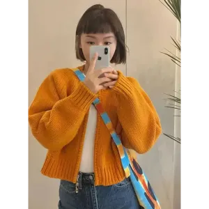 Vibrant Solid Orange Knitted Cardigan with Crew Neck Design