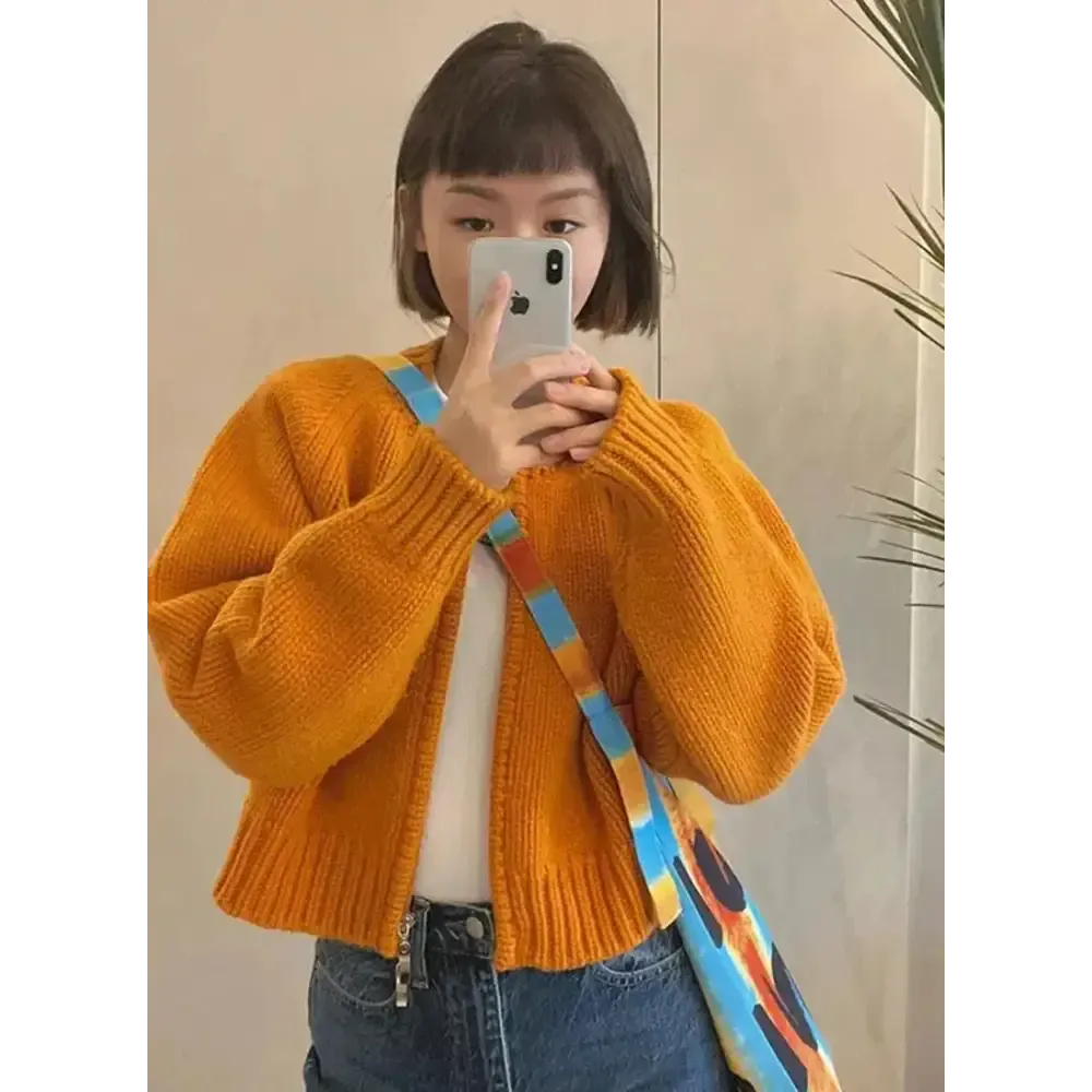 Vibrant Solid Orange Knitted Cardigan with Crew Neck Design